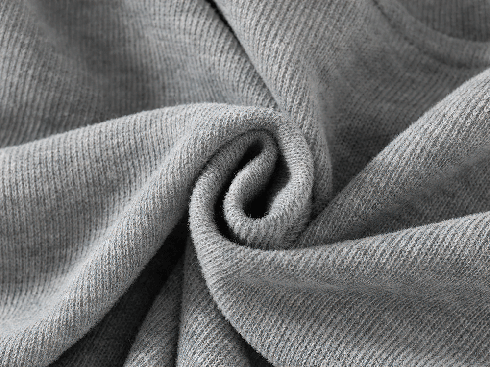 Close-up of soft gray fleece fabric showcasing texture and warmth, ideal for cozy hooded sweatshirts for kids.